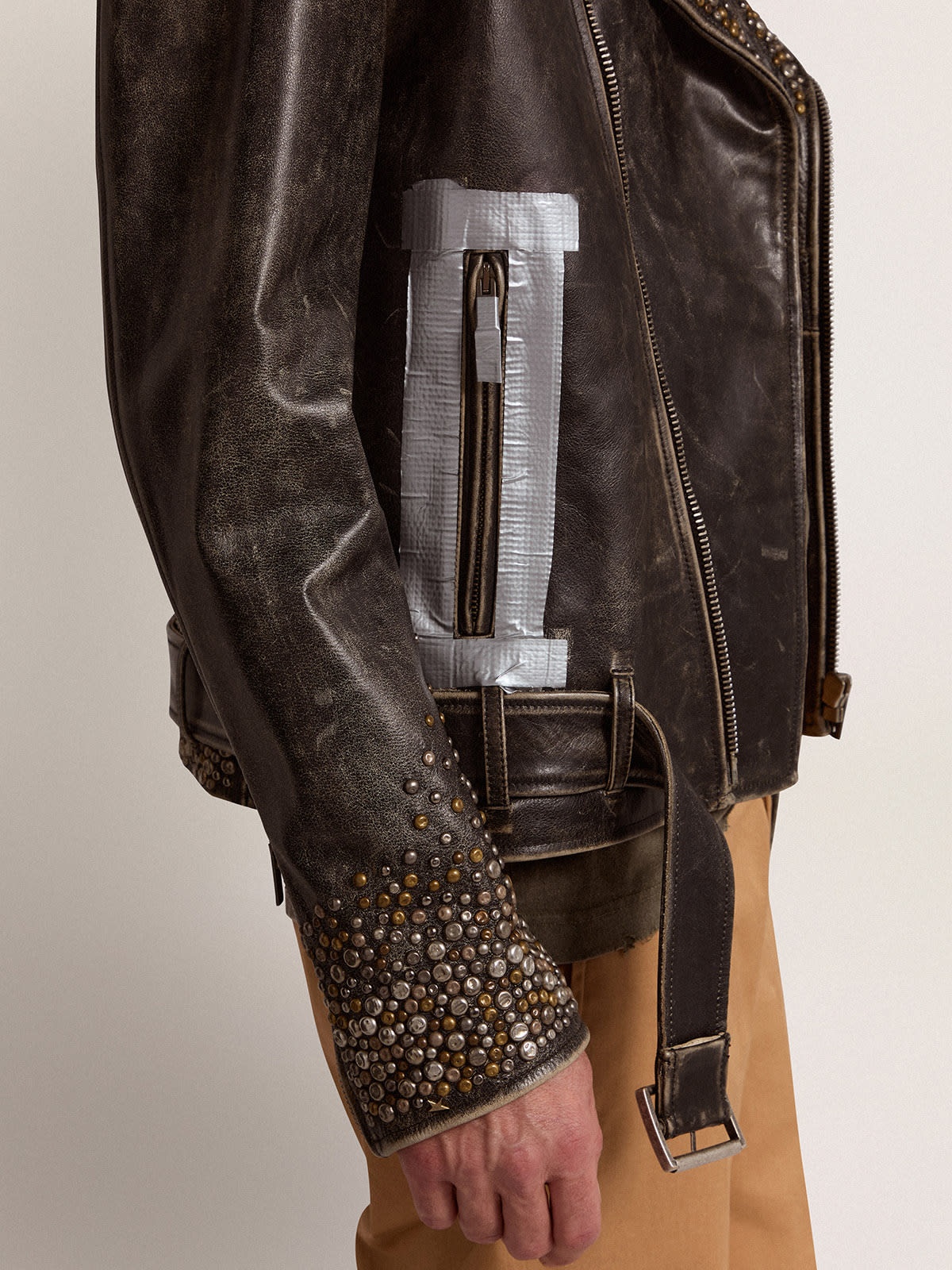 Men's leather biker jacket with hammered studs and adhesive tape - 5