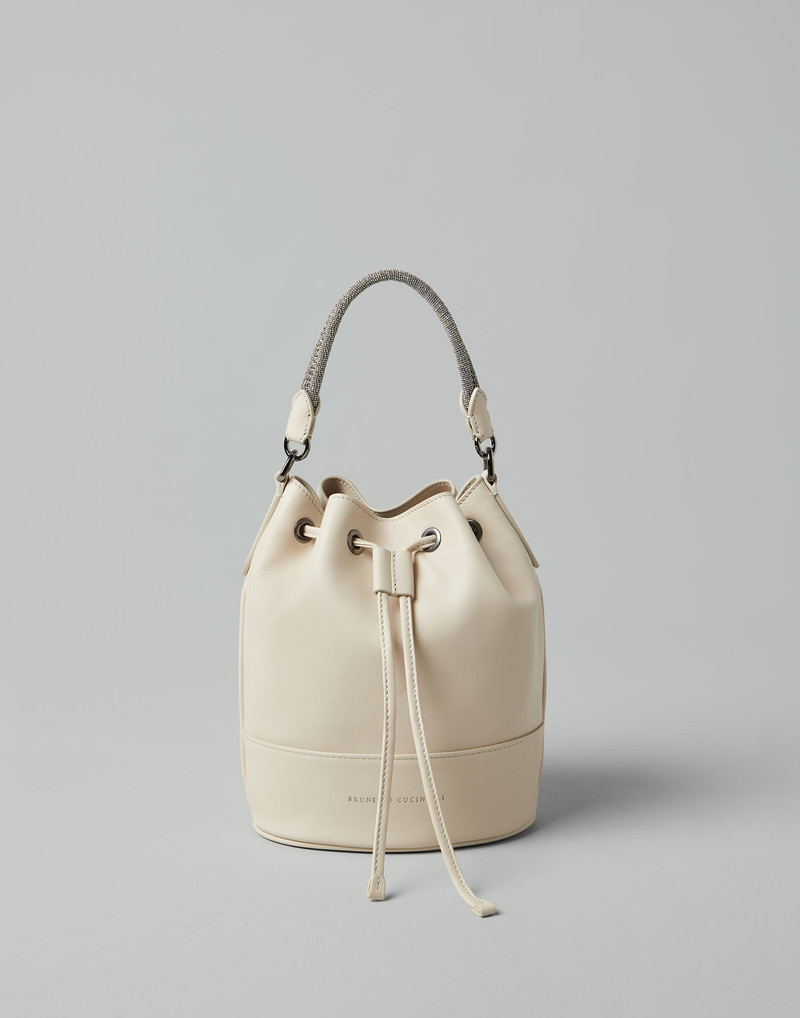 Calfskin bucket bag with precious braided handle 1
