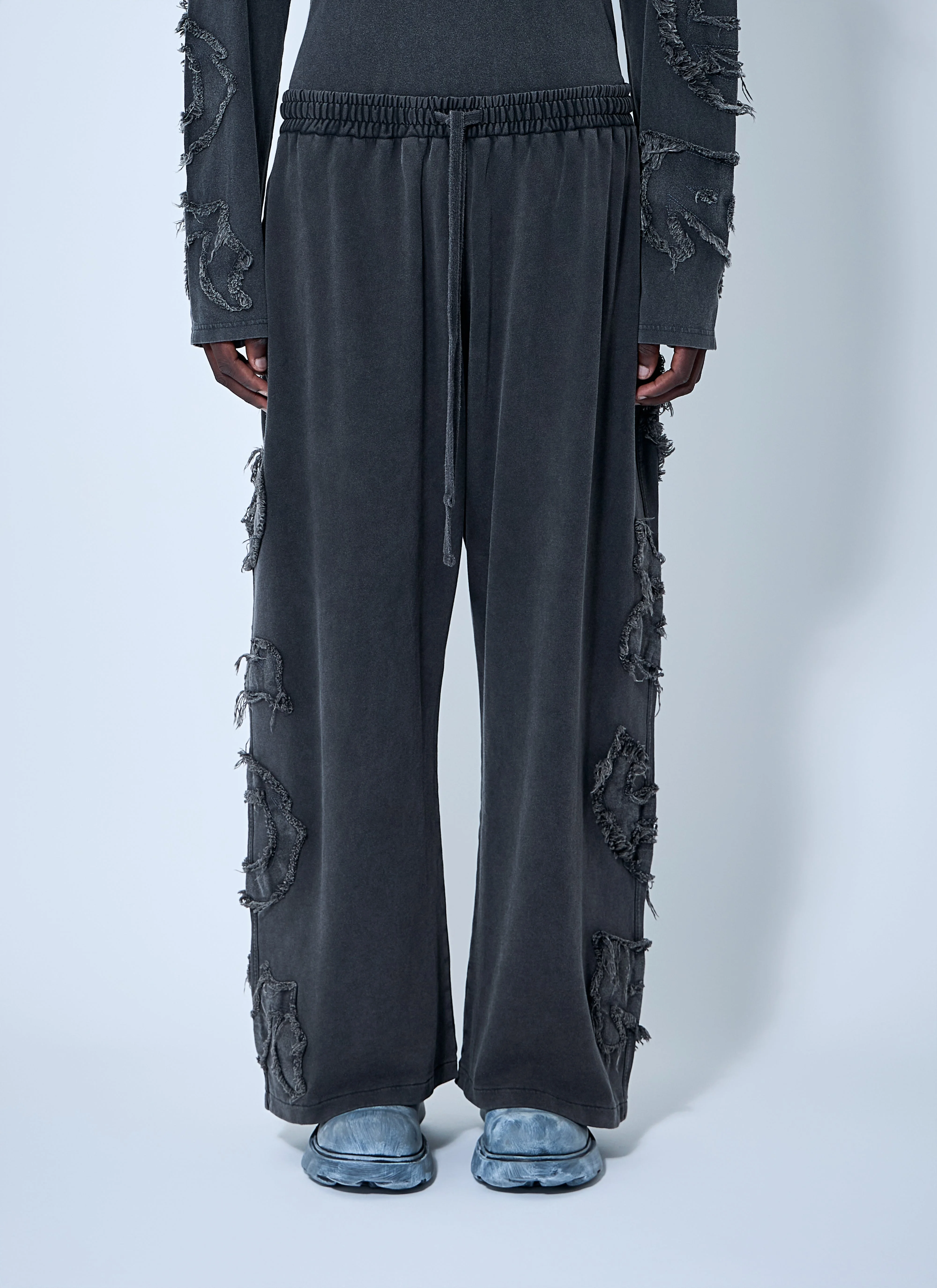 Acne Studios Men Distressed Logo Track Pants - 1