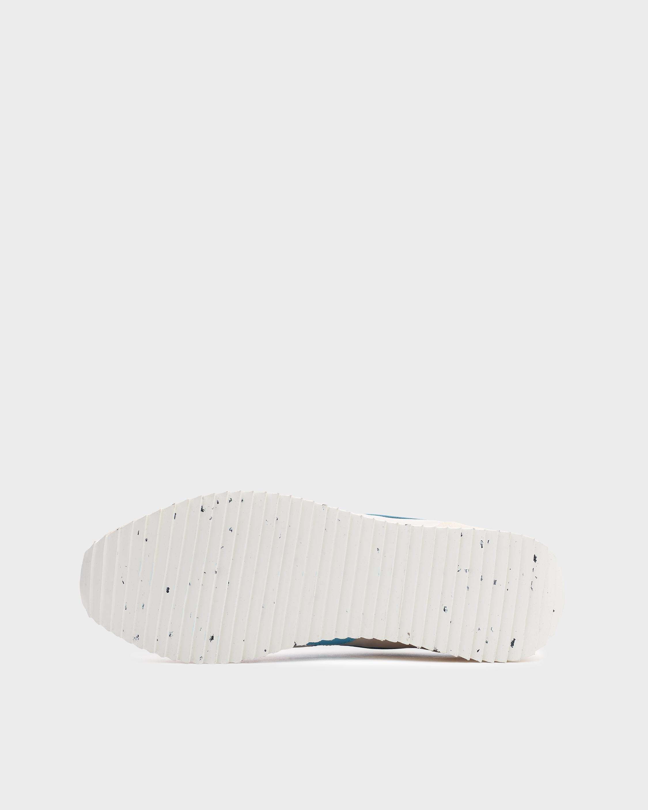 Retro Runner
Leather and Recycled Material Sneaker - 5