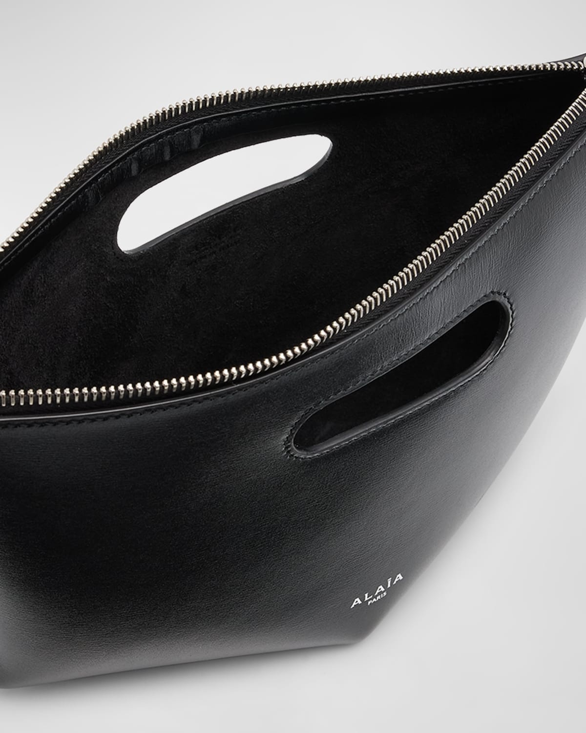 Alaïa Folded Zipped Leather Clutch Bag | neimanmarcus