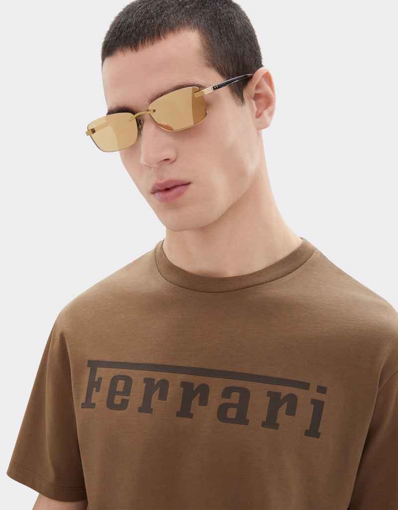 Ferrari Ferrari sunglasses in matte gold titanium and acetate with transparent gold mirrored lenses outlook