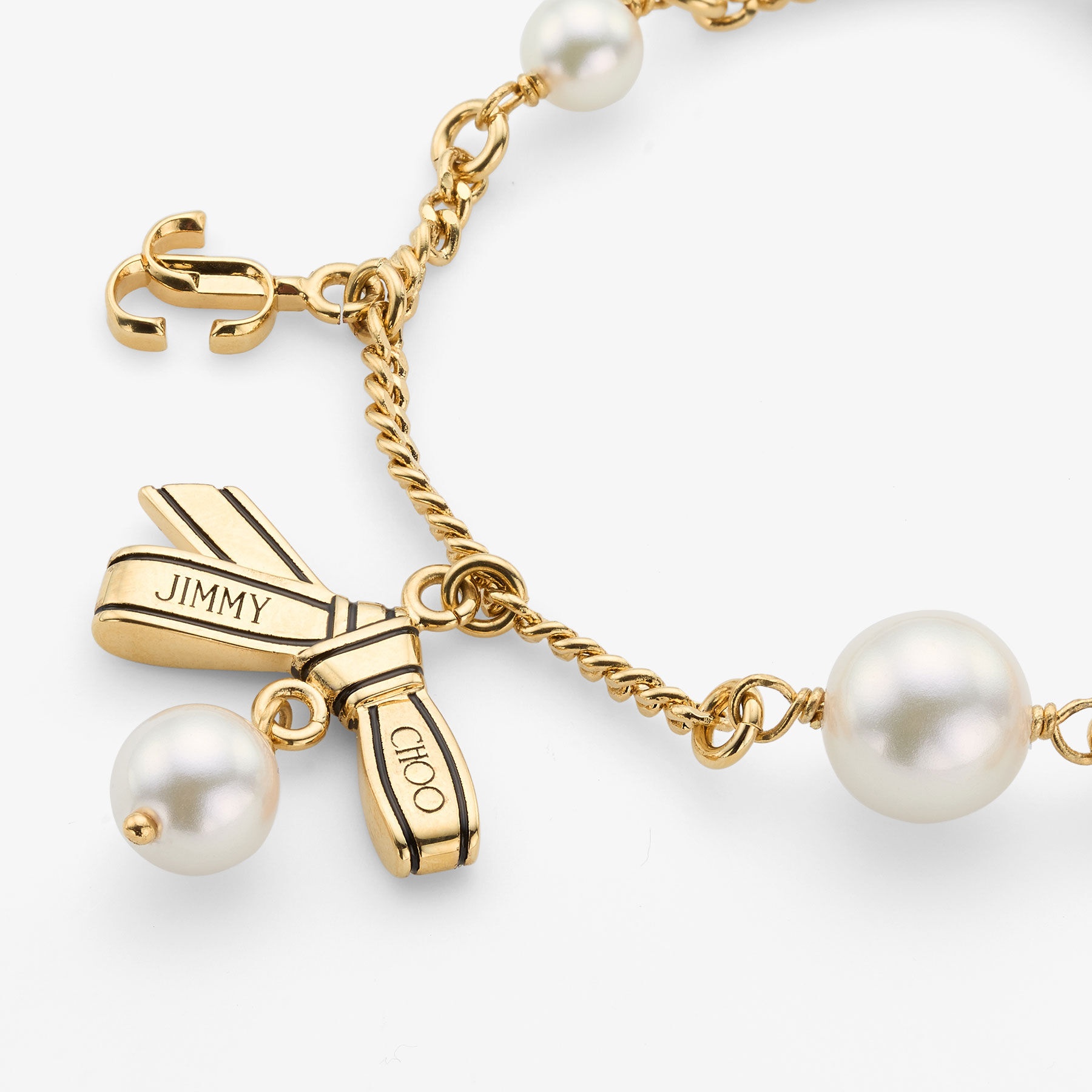 Multi Charm Ribbon  Bracelet
Gold Metal Charm Bracelet with Ribbons & Pearls - 2