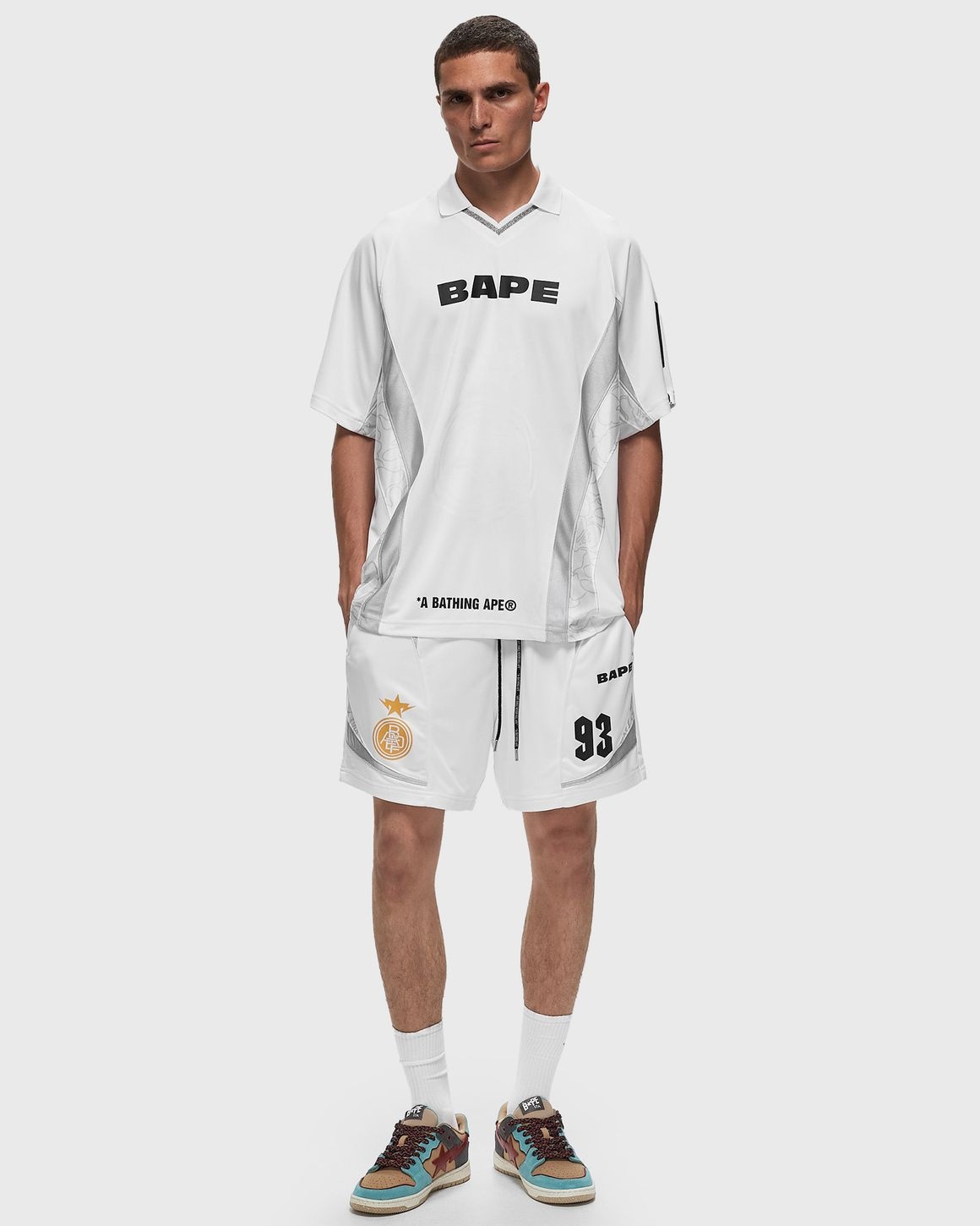 A BATHING APE MULTI LOGO RELAXED FIT SOCCER SHORTS REVERSIBLE