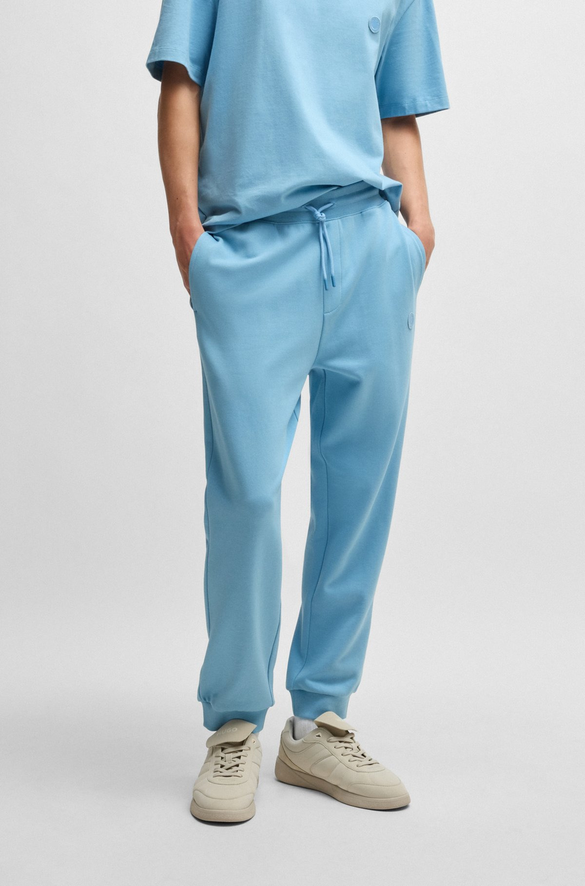 COTTON-TERRY TRACKSUIT BOTTOMS WITH HAPPY HUGO LOGO PATCH - 2