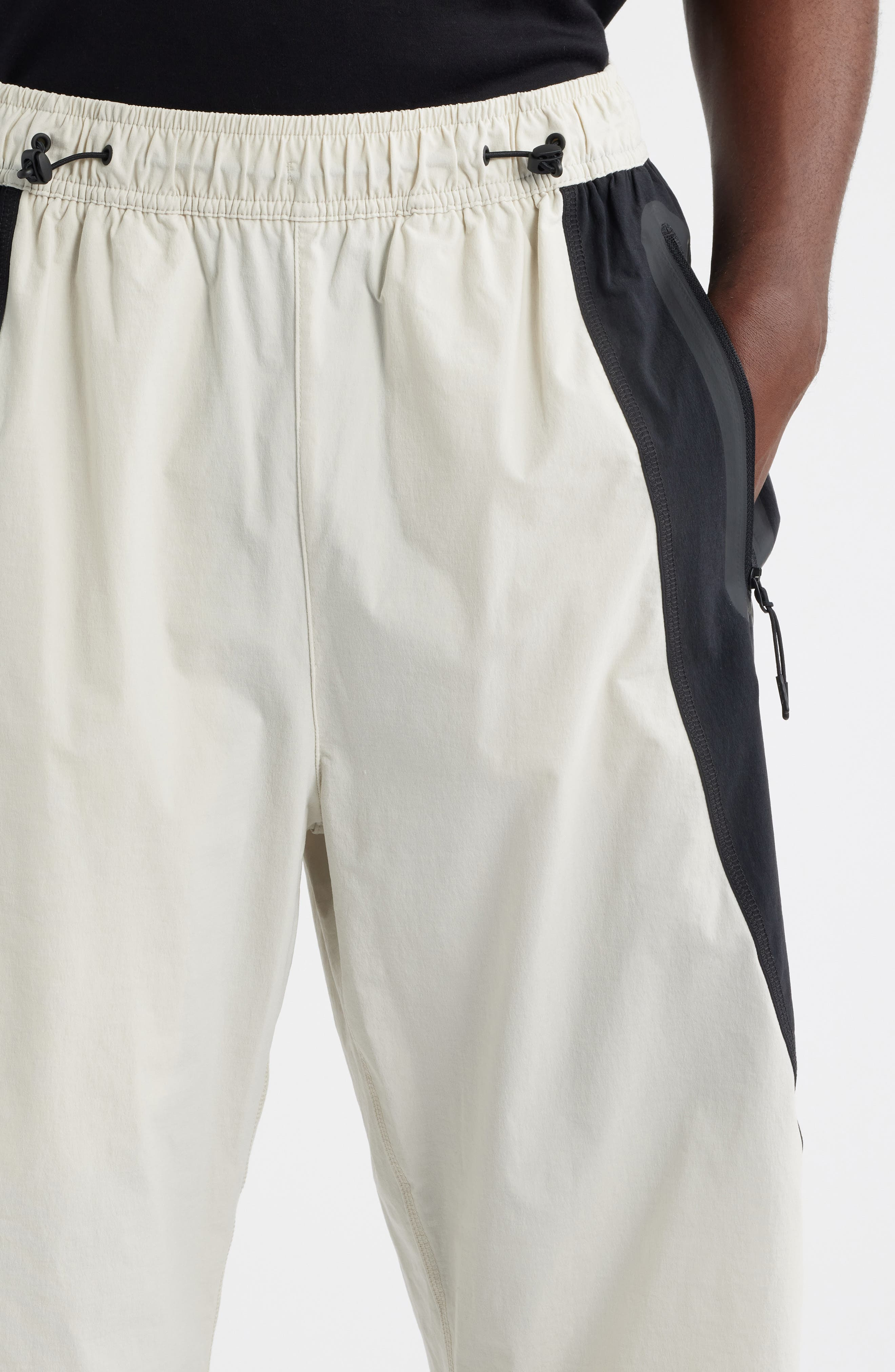 Nike Tech Dri-FIT Woven Oversize Stretch Nylon Pants in Light Bone/Black at Nordstrom - 4