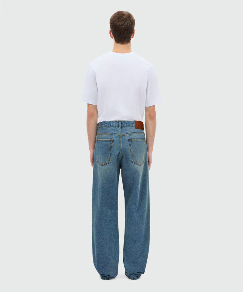 Medium-wash denim trousers with localized distressing, five-pocket design 3