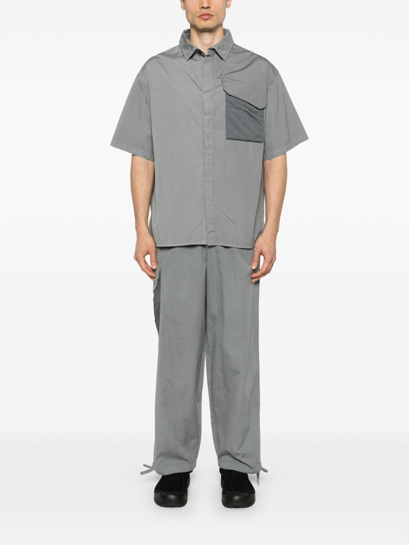 A-COLD-WALL* logo-print trousers outlook