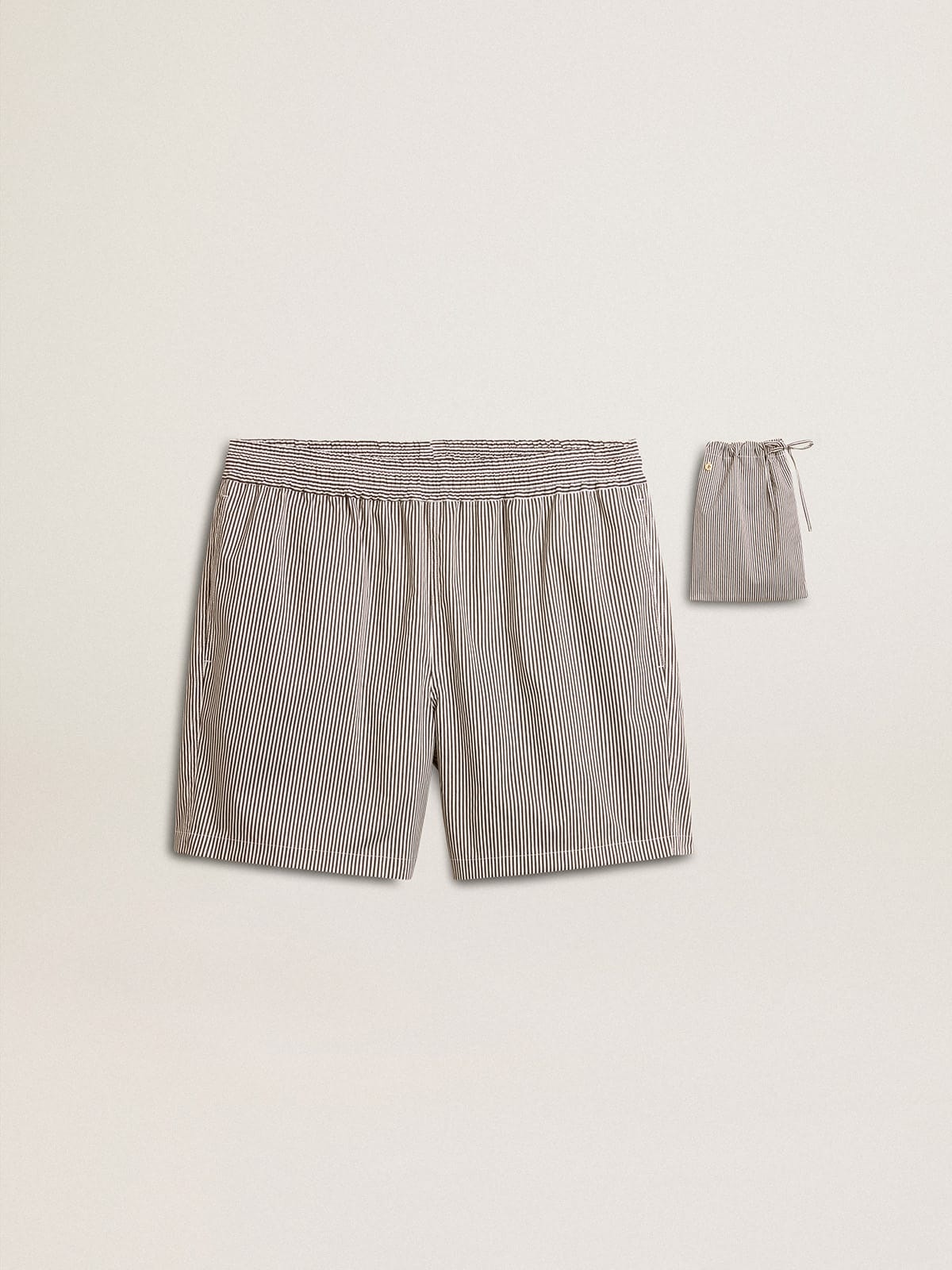Swim shorts in blue and white striped technical fabric - 1