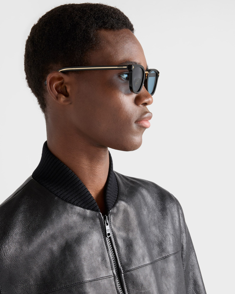 Prada Sunglasses with the iconic metal plaque outlook