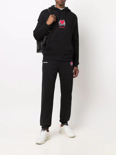 Axel Arigato Keith Haring track pants outlook