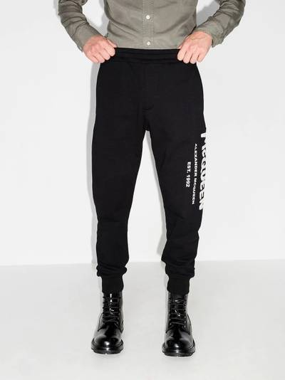 Alexander McQueen logo graffiti print track pants outlook