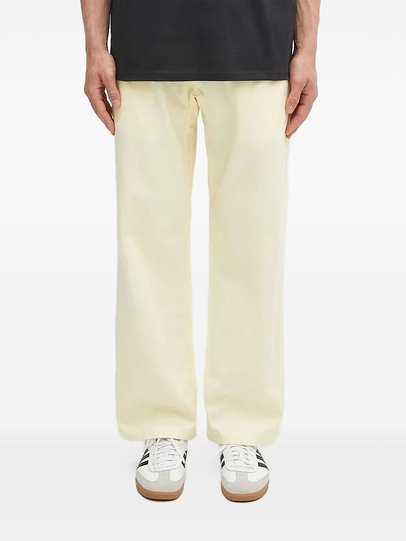 elasticated-waist belted trousers 1