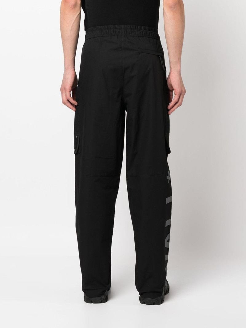 Overset Tech logo-print trousers 4