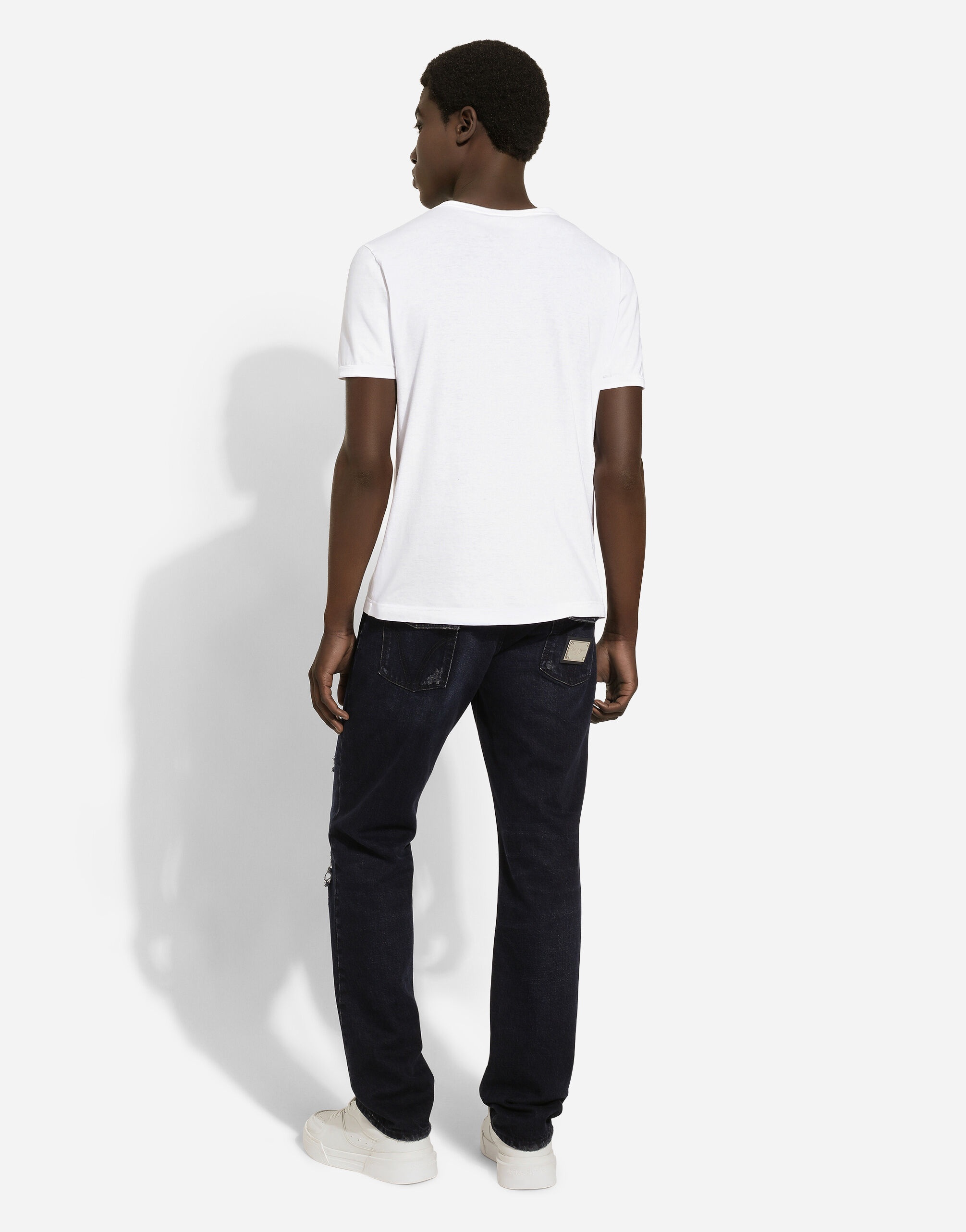 Blue denim jeans with abrasions and rips - 3