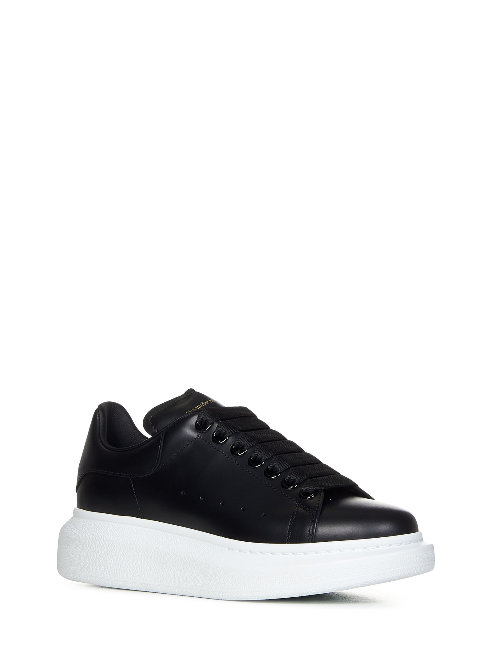 Black sneakers in smooth calfskin with oversized rubber sole and gold signature. - 2