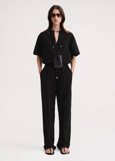 Totême Press-creased drawstring trousers black outlook