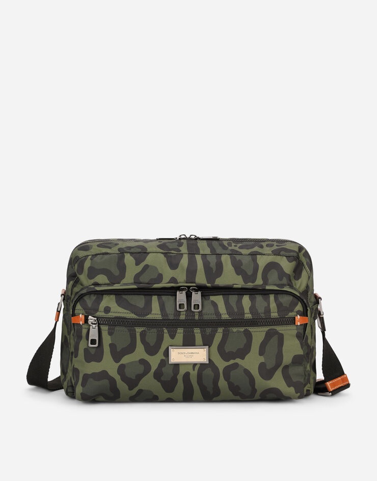 Nylon messenger bag with a leopard print against a green background and branded plate - 1