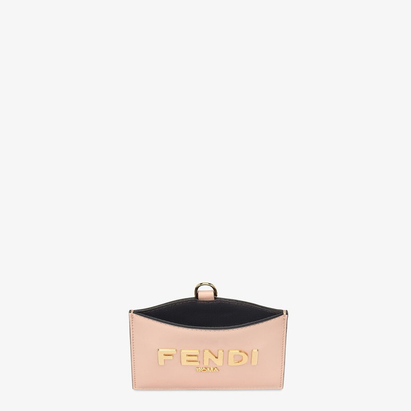 FENDI Fendi Roma name badge with a flat pocket and metal chain. Made of pink leather. Gold-finish metalwar outlook