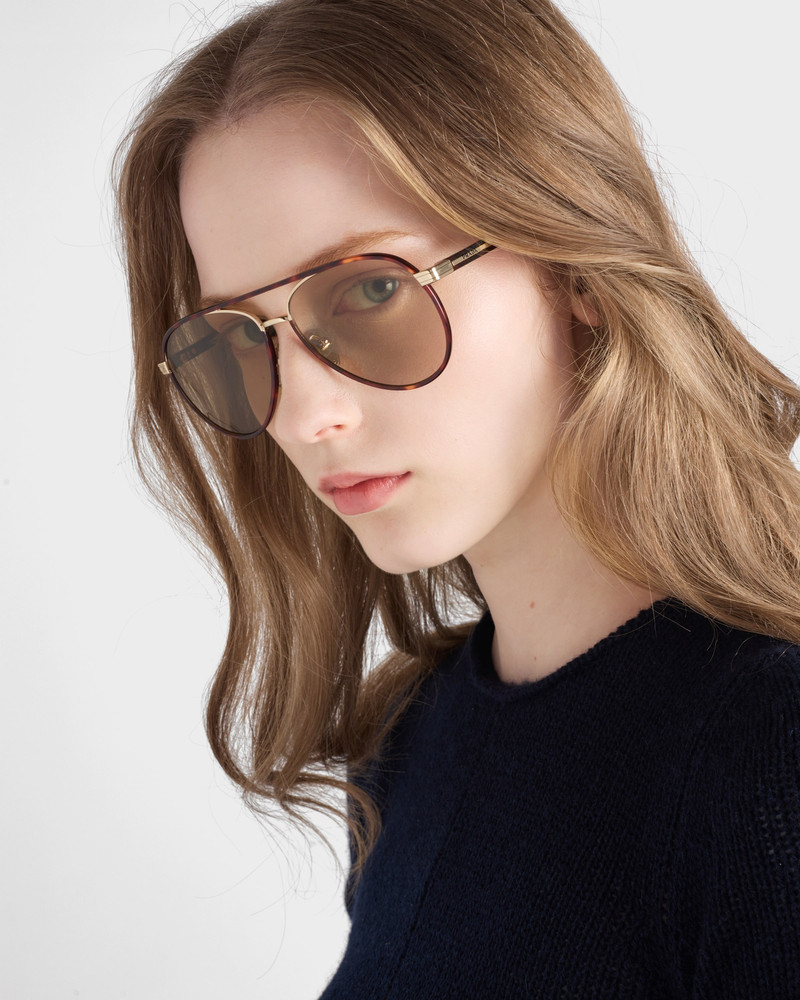 Prada Prada sunglasses with the iconic metal plaque outlook