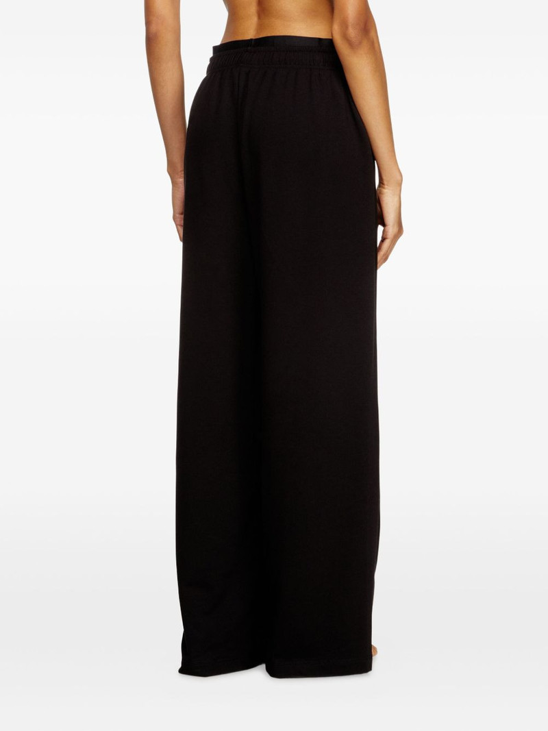 Leslie-D-Pop logo-print trousers 4