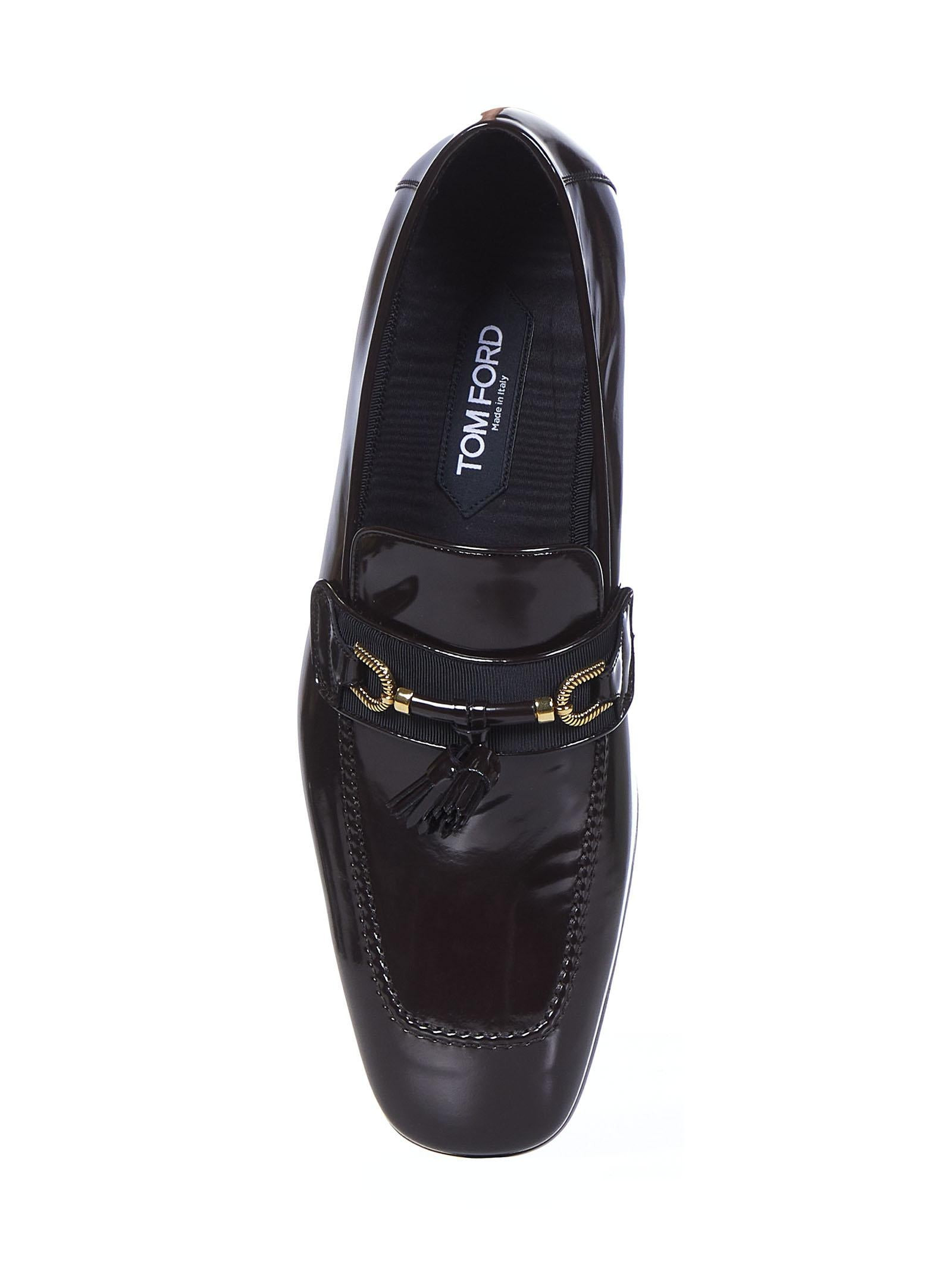 Chocolate-colored patent calfskin loafers with golden metal horsebit and tassels. - 3