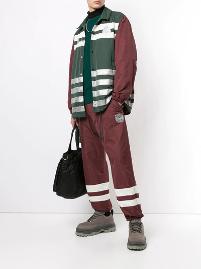 UNDERCOVER hi-vis track pants outlook