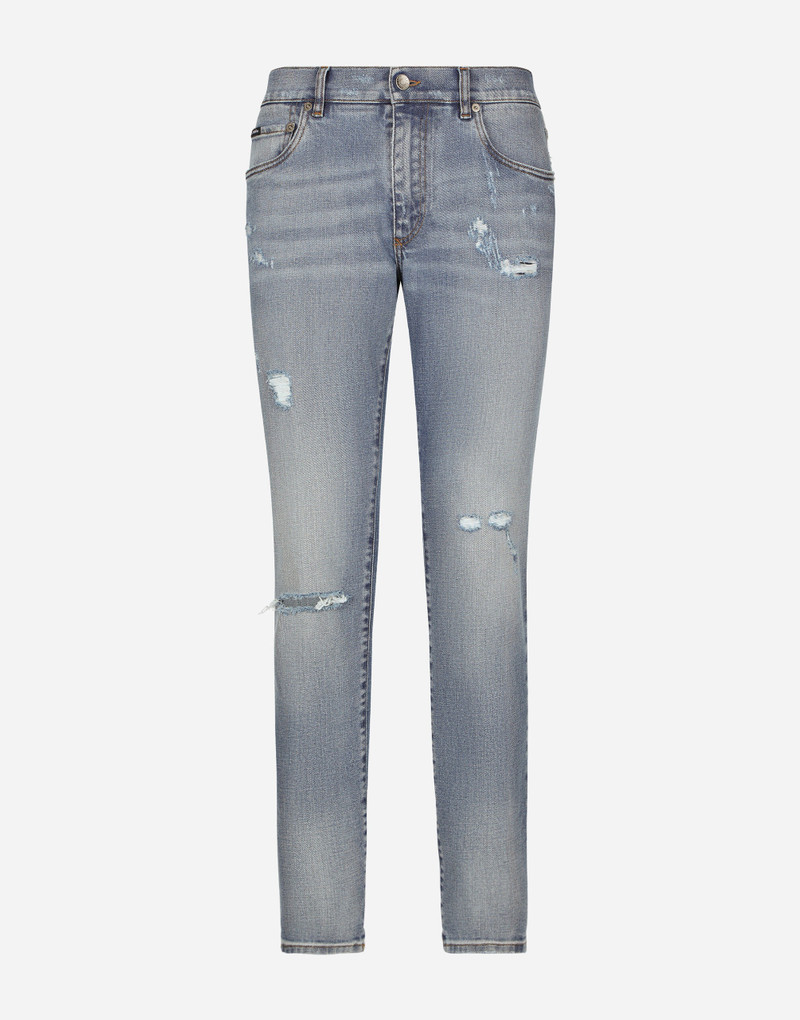 Slim-fit blue stretch denim jeans with abrasions 1