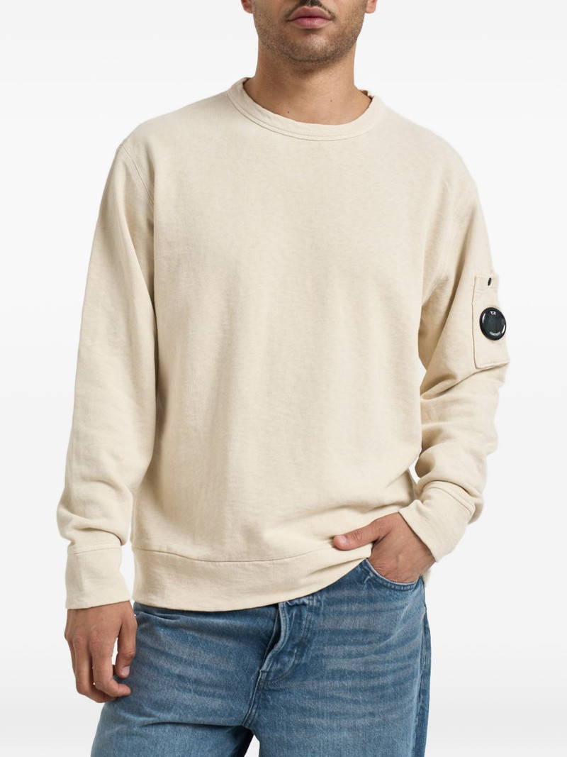 arm lens pocket sweater 1