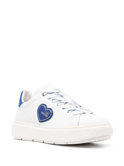 Moschino logo-patch low-top sneakers outlook