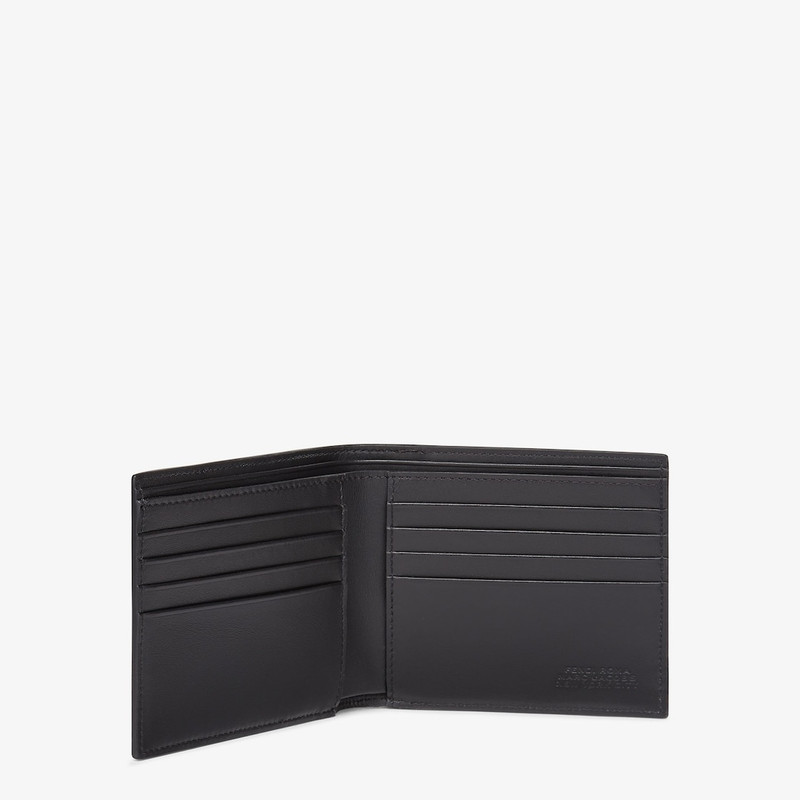 FENDI Wallet with eight interior card slots and two compartments for bills. Made of leather printed with t outlook