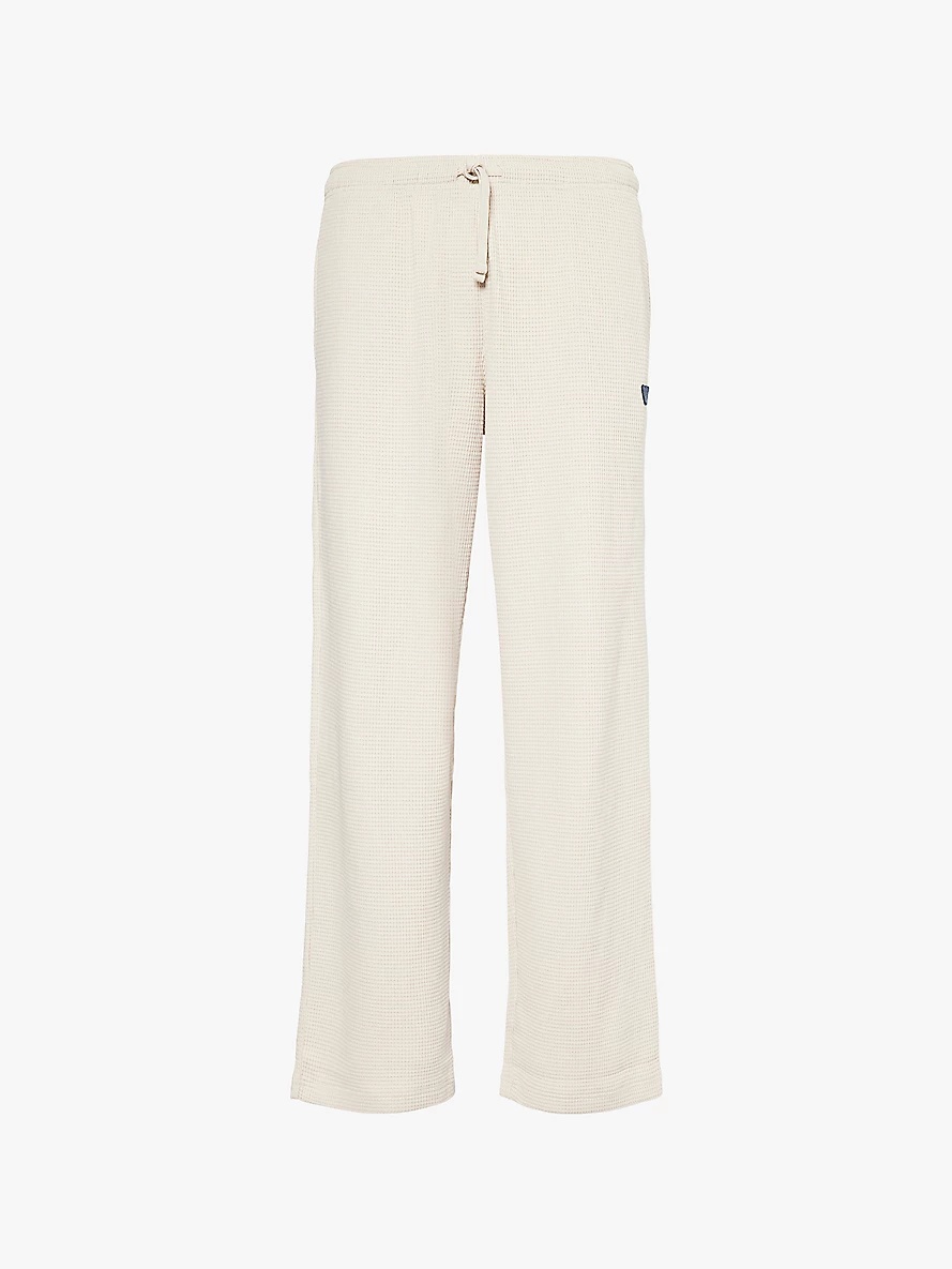 Brand-patch tapered cotton-jersey jogging bottoms - 1