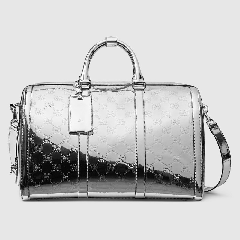 Medium embossed GG duffle bag 1