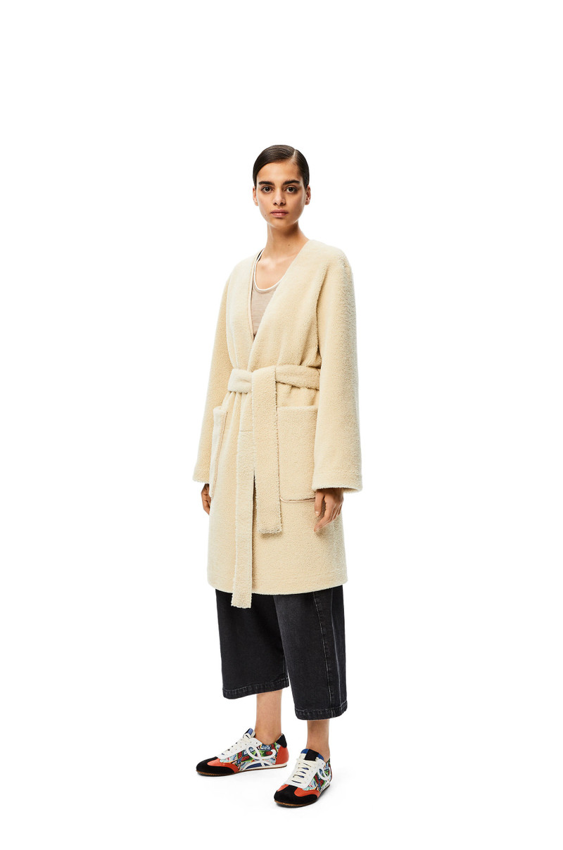 Collarless wrap coat in shearling 3