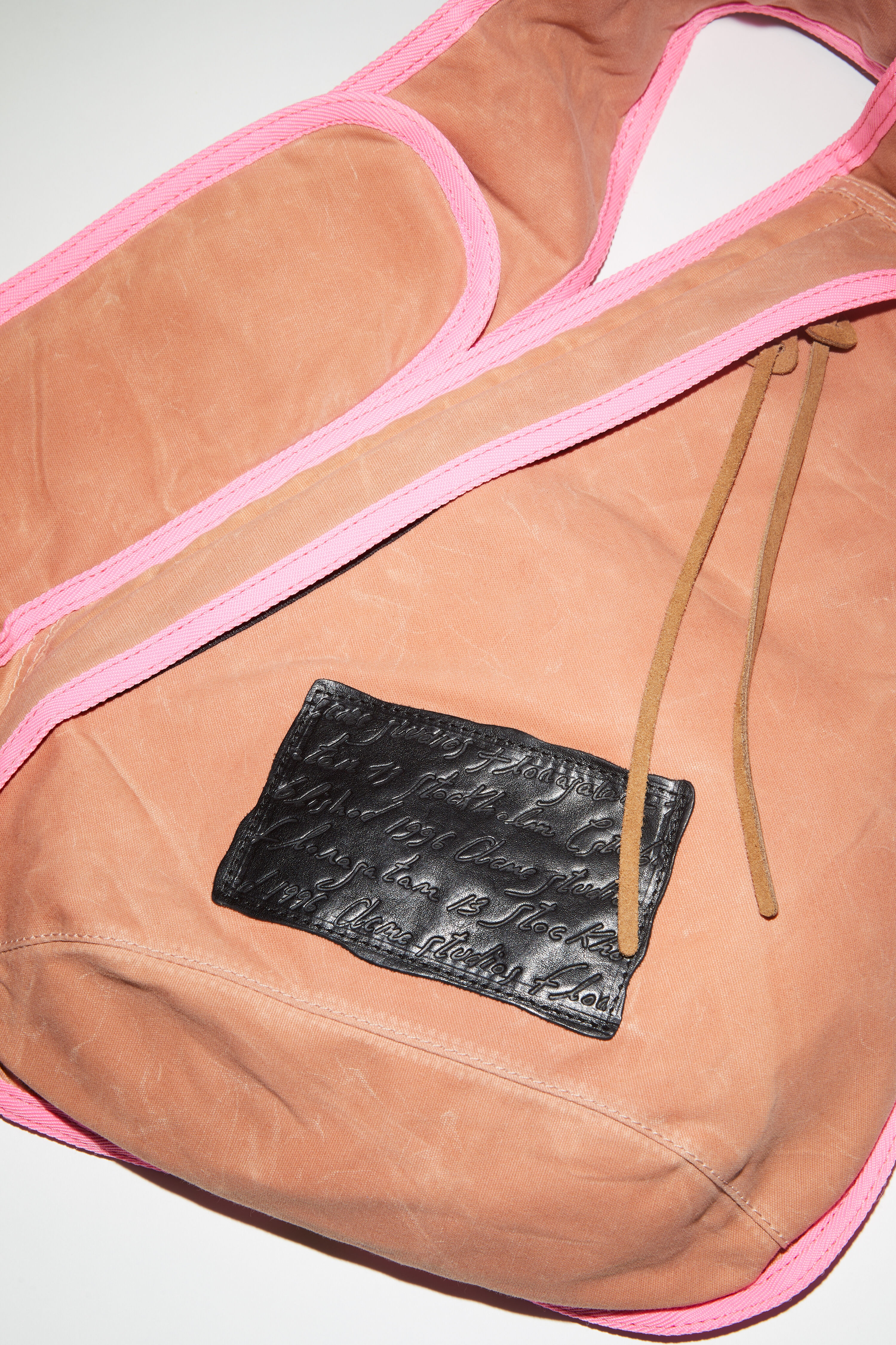 Acne Studios Sling backpack - Pink/Fluo Pink | REVERSIBLE