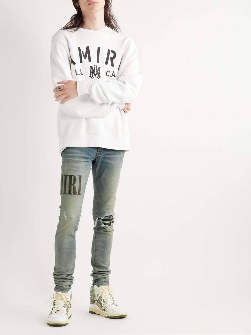 AMIRI Skinny-Fit Leather-Trimmed Distressed Jeans outlook