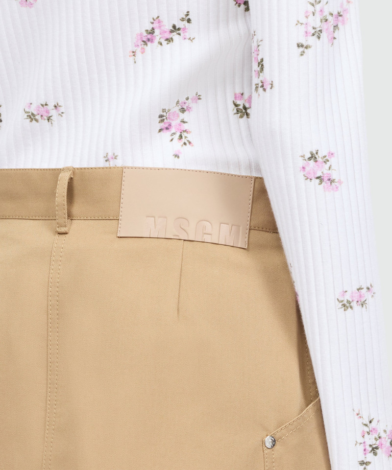 Pink cotton gabardine wrap miniskirt with metal buttons 5