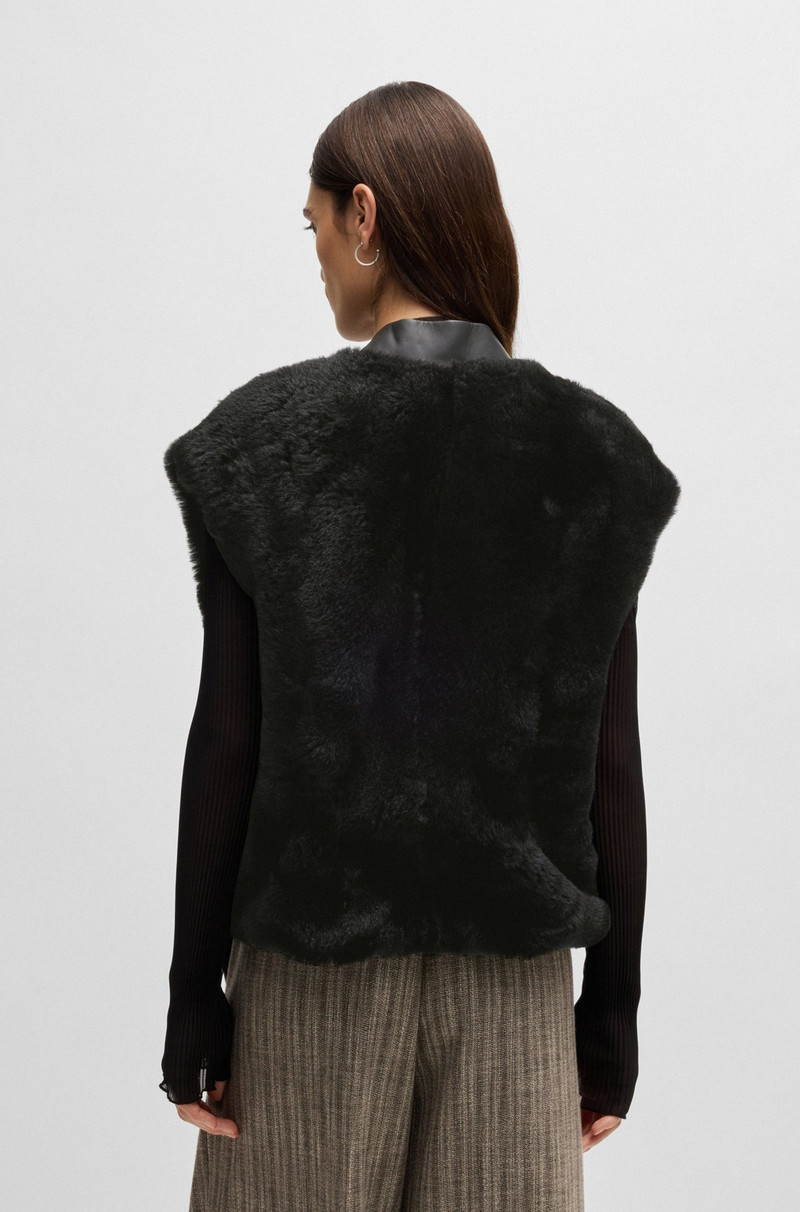 SLEEVELESS SHEARLING JACKET WITH LEATHER TRIMS 4