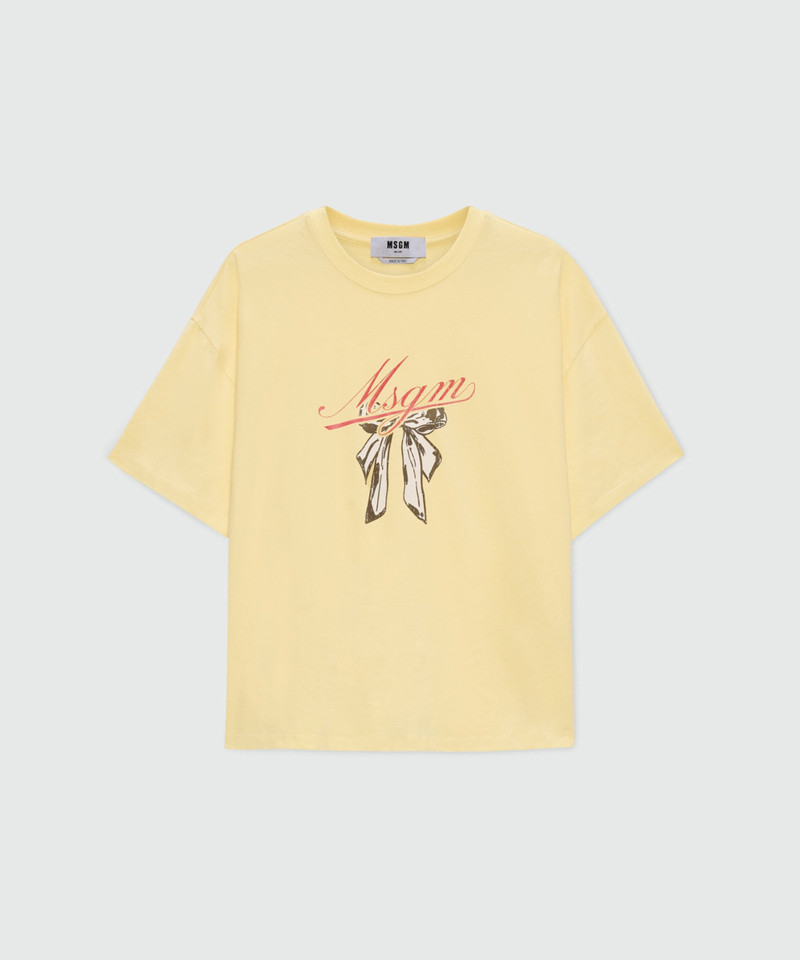 Yellow T-shirt with MSGM graphic print and bow. 1
