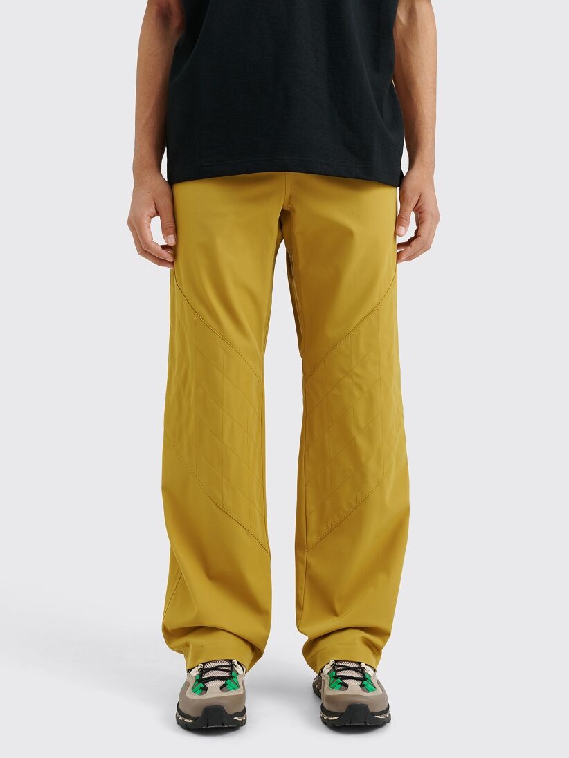 ASICS NOVALIS LIATRIS TROUSER MEDALLION YELLOW