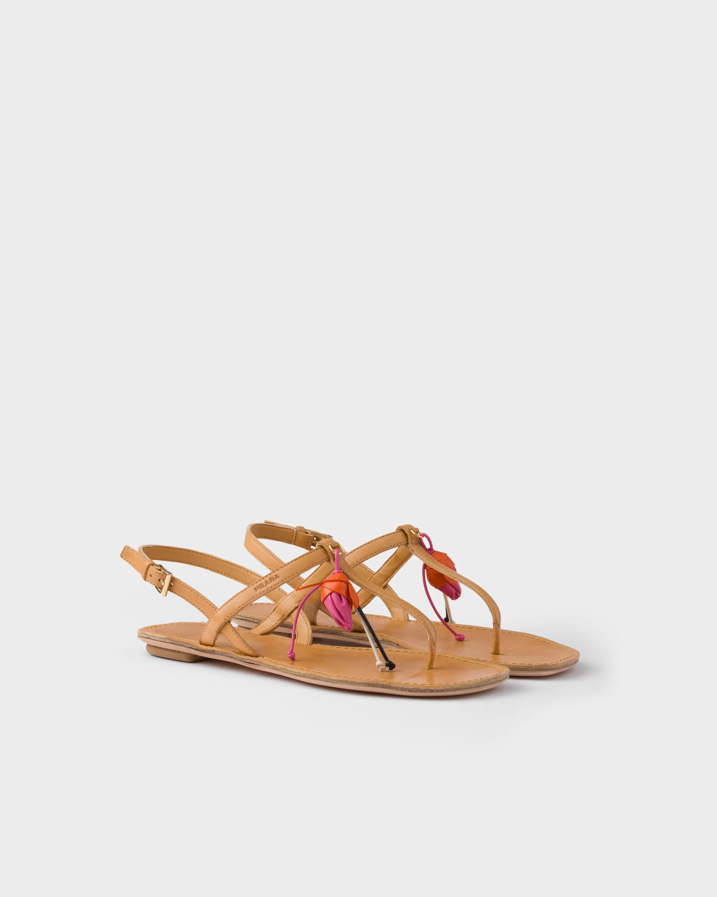 Antiqued leather thong sandals with floral ornament - 1