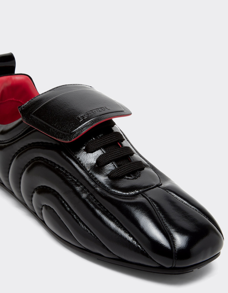 Running trainers in wet-effect leather 7