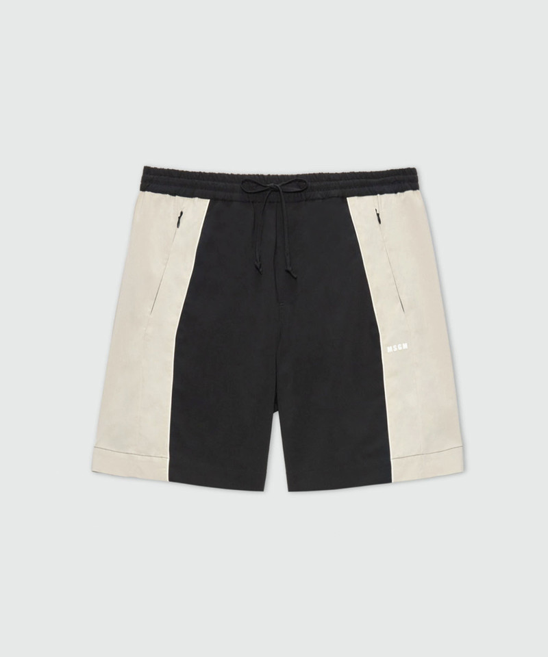 Black stretch cotton Bermuda shorts with color-block inserts. 1