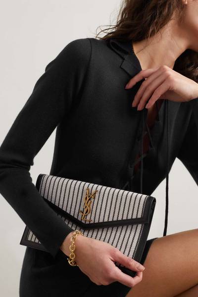 SAINT LAURENT Formentera leather-trimmed striped straw pouch outlook