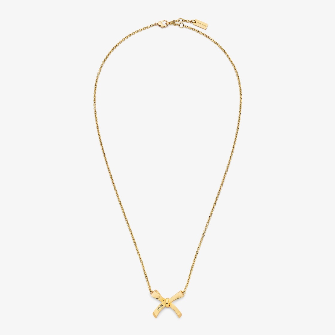 Fine chain necklace with small bow-shaped pendant. Clip closure. Made of gold-finish metal. Decorate - 1