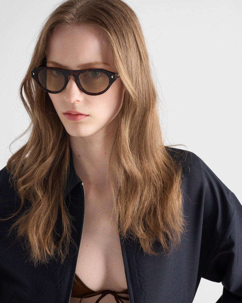 Prada Prada sunglasses with the iconic metal plaque outlook