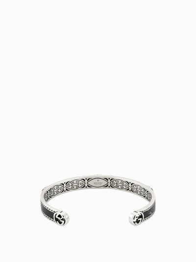 GUCCI Interlocking G Cuff Gucci bracelet in enamelled silver with GG monogram and decorated crest outlook