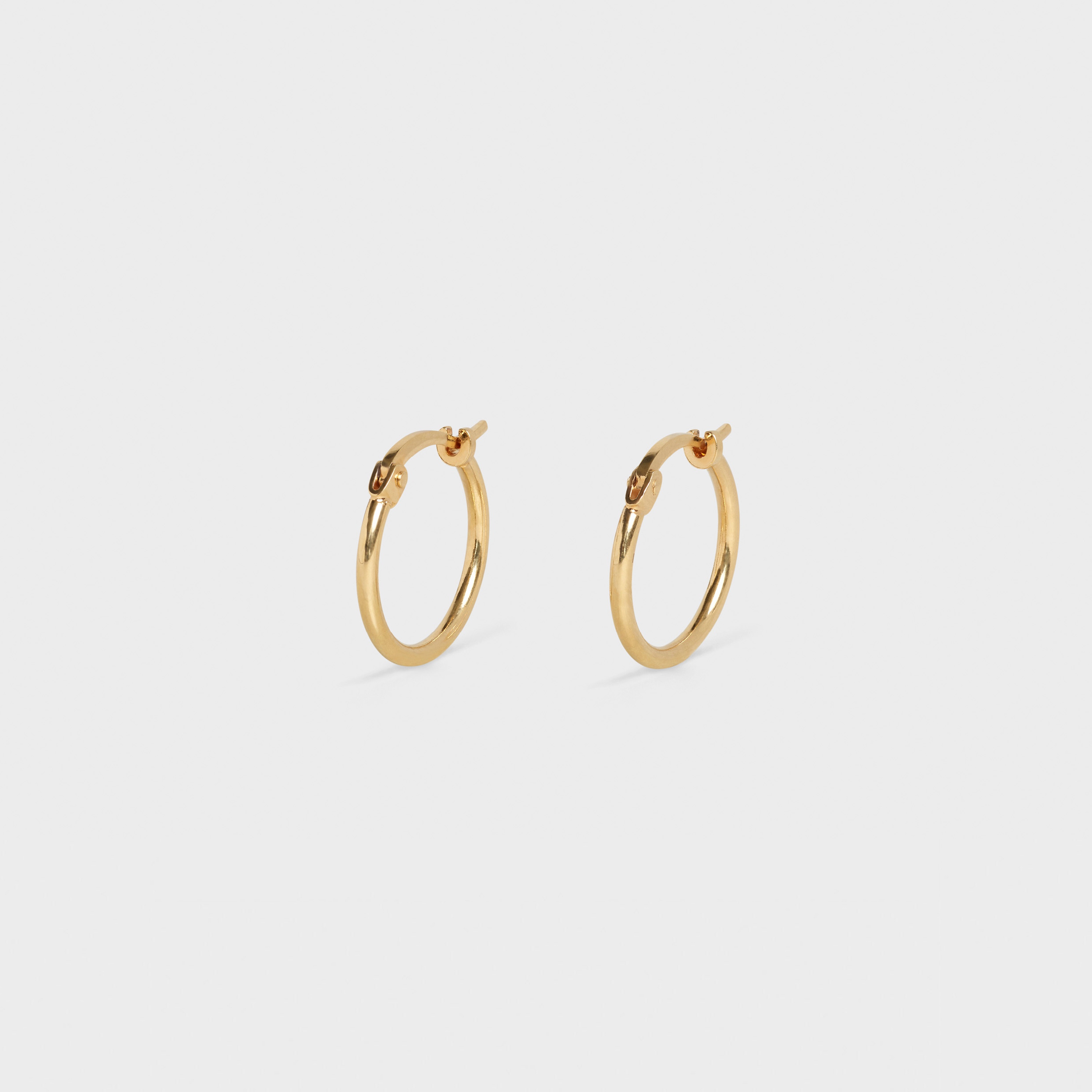 SIMPLE FORMS EXTRA SMALL HOOPS  IN  BRASS WITH GOLD FINISH - 2