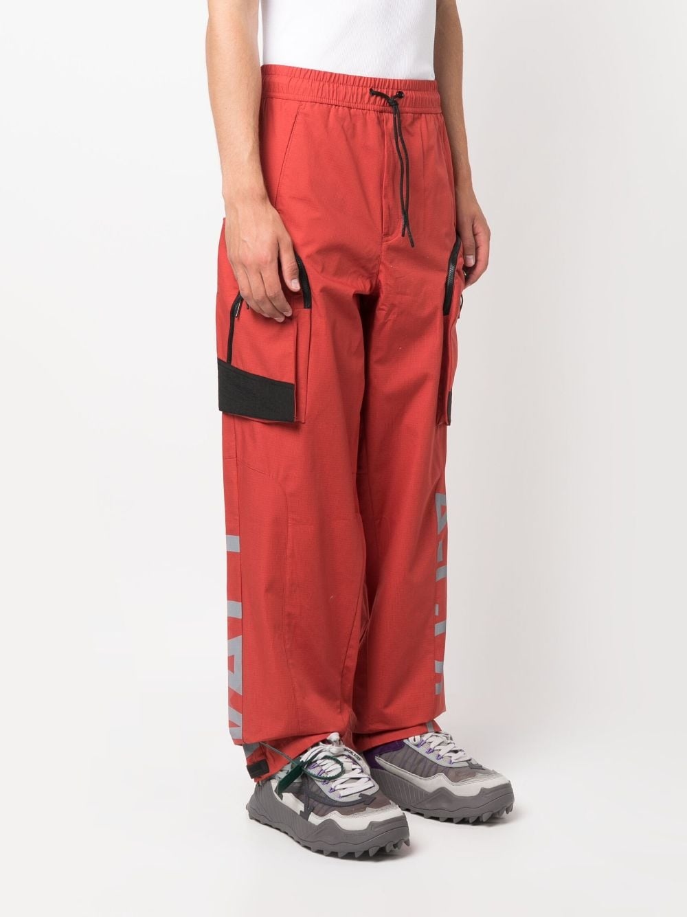 Overset Tech logo-print trousers - 3