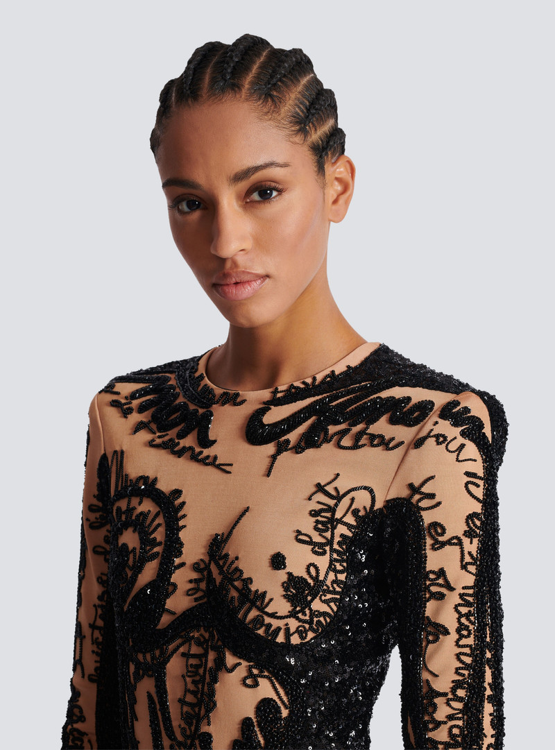 Short embroidered dress with body motif 7